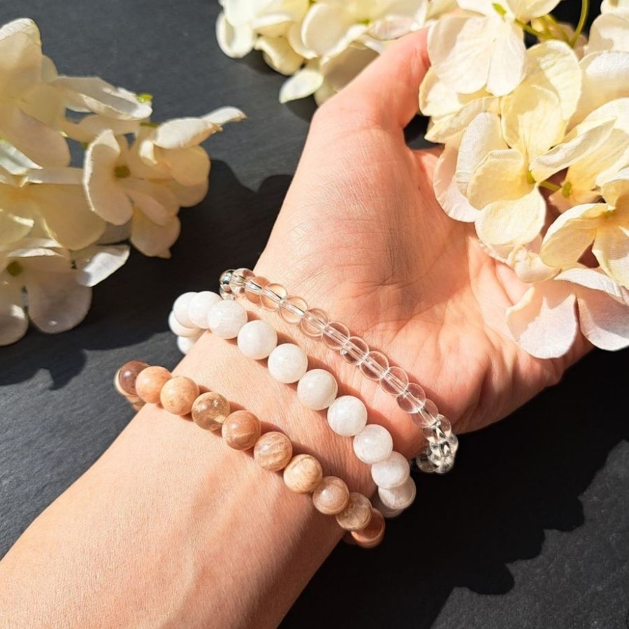 3 crystal bracelets on a woman wrist.