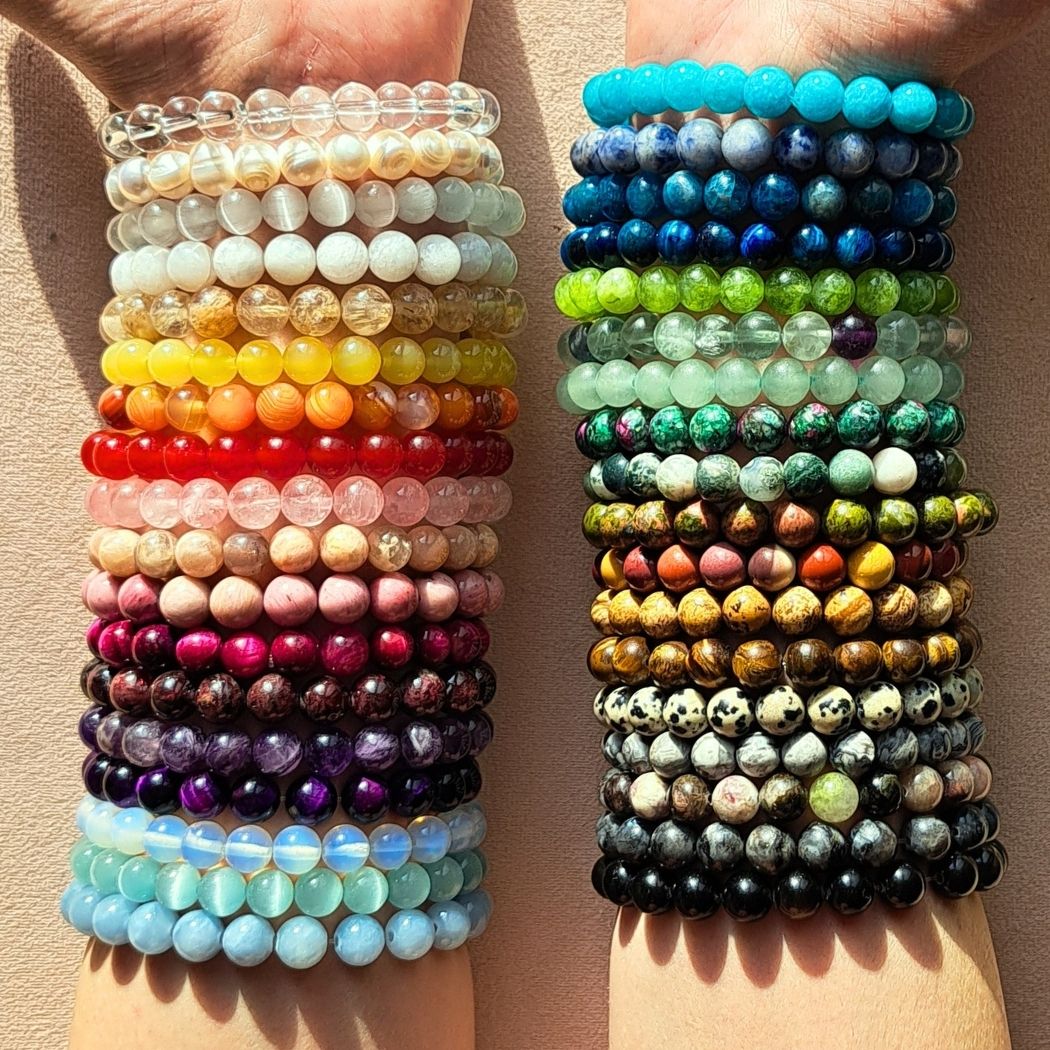 Crystal bracelets on woman wrists.