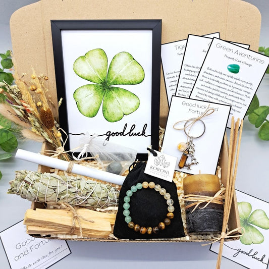 Good fortune gift set, containing print frame, white sage, palo santo, crystal bracelet, candle and other gift elements. Front look.