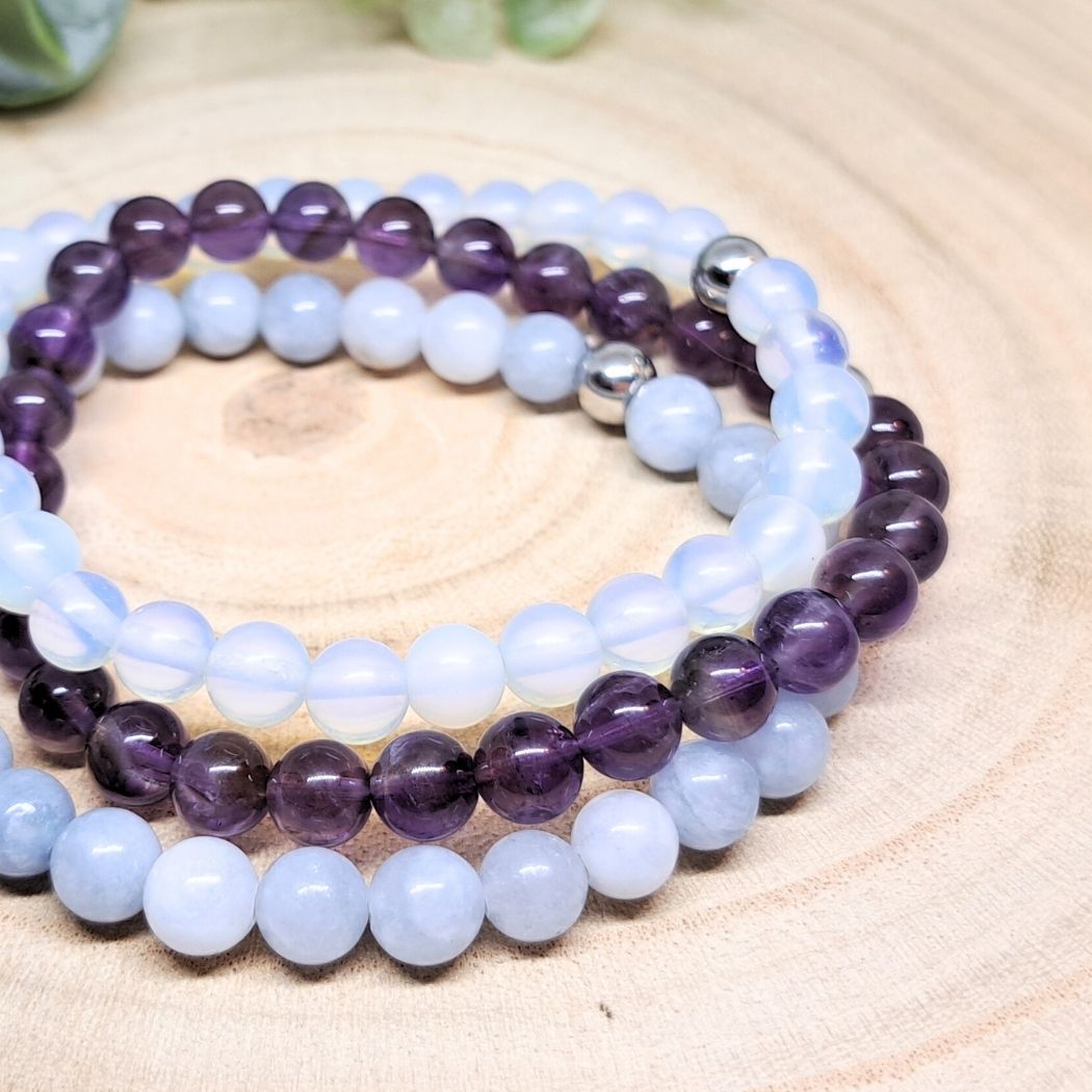 Blue and purple stone bracelets close look.