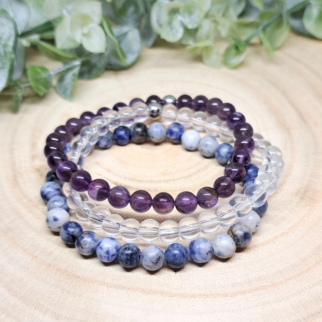 Purple, blue and clear bracelets frontal look.