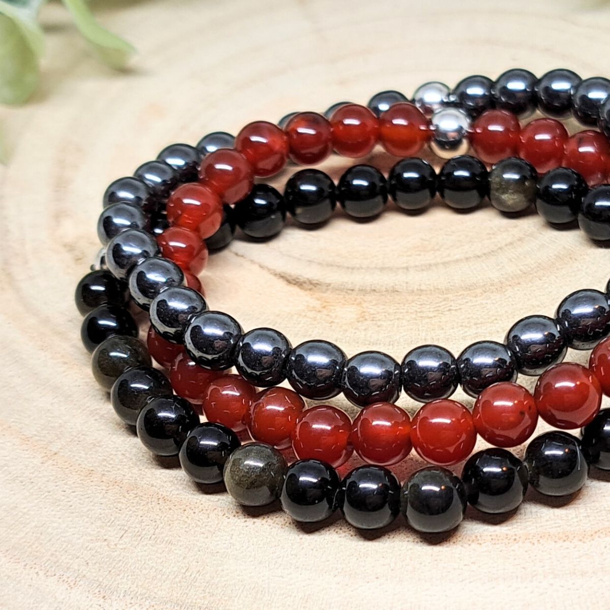 Black and red bead bracelets close look.