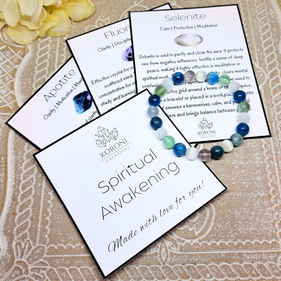 Crystal beaded bracelet over explanation cards.