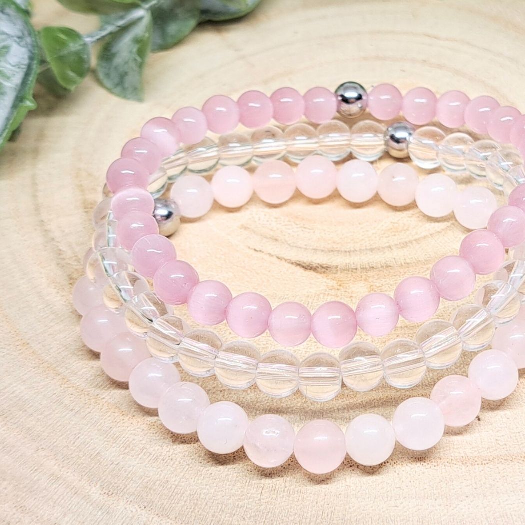 Pink and white stone bracelets close look.